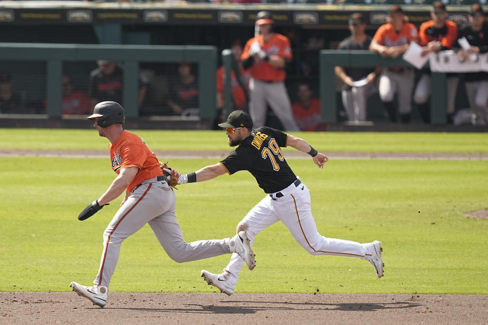 Pittsburgh Pirates' Chris Owings forces an out against Baltimore Orioles' Jordan Westburg near second base in the fifth inning during a spring training baseball game, Tuesday, Feb. 28, 2023, in Bradenton, Fla. (AP Photo/Brynn Anderson)