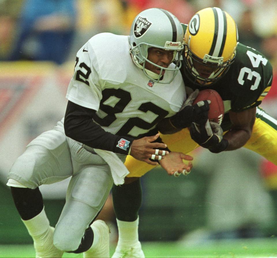 Green Bay Packers rookie cornerback Mike McKenzie makes an interception in the end zone to prevent a touchdown by Oakland Raiders wide receiver James Jett during the second quarter of their game Sunday, September 12, 1999 at Lambeau Field in Green Bay, Wis.(Milwaukee Journal Sentinel photo by Tom Lynn)