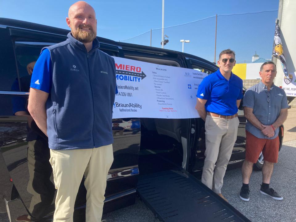 Lance Hollabaugh, Brian Harrison and Brian Gates, from left, are shown with a mobility van from Palmiero Toyota in Meadville on April 21. Gates is raising money to buy the van for a Millcreek Navy veteran. Harrison is co-owner of Palmiero Toyota, where Hollabaugh is a salesman.