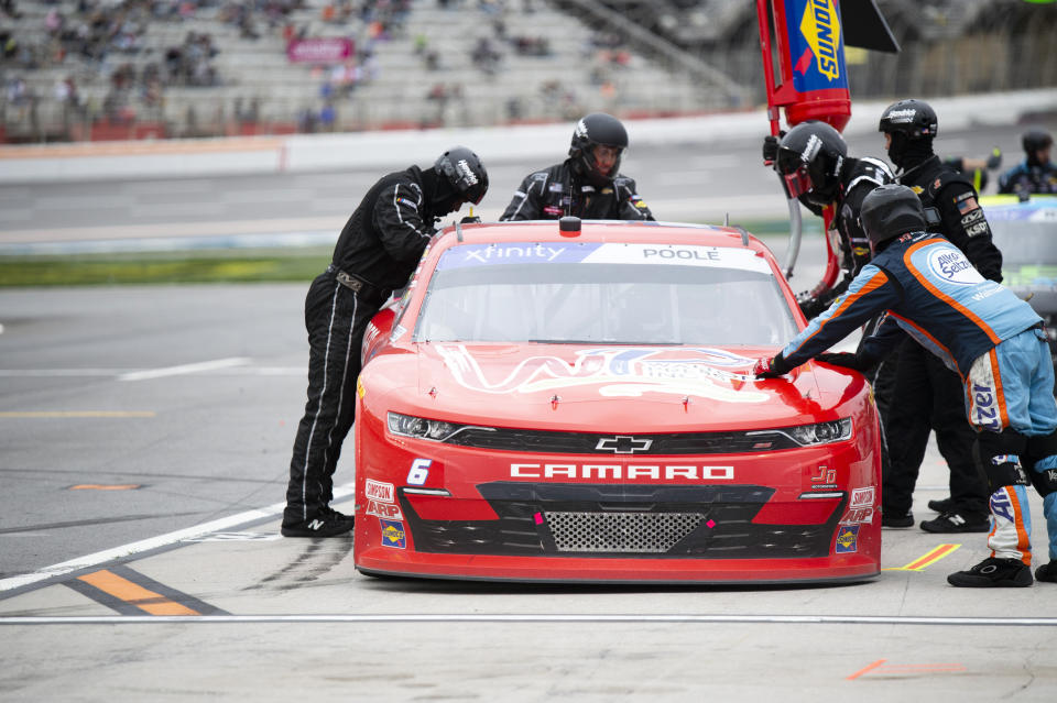 Brennan Poole makes a pit stop during the NASCAR Xfinity Series auto race at Atlanta Motor Speedway on Saturday, March 18, 2023, in Hampton, Ga. (AP Photo/Hakim Wright Sr.)