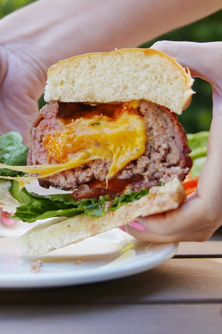 <p>Just when you thought burgers couldn't get any better ...</p><p>Get the recipe from <a href="https://www.delish.com/cooking/recipe-ideas/recipes/a53148/beer-can-burgers-recipe/" rel="nofollow noopener" target="_blank" data-ylk="slk:Delish;elm:context_link;itc:0;sec:content-canvas" class="link ">Delish</a>.</p>