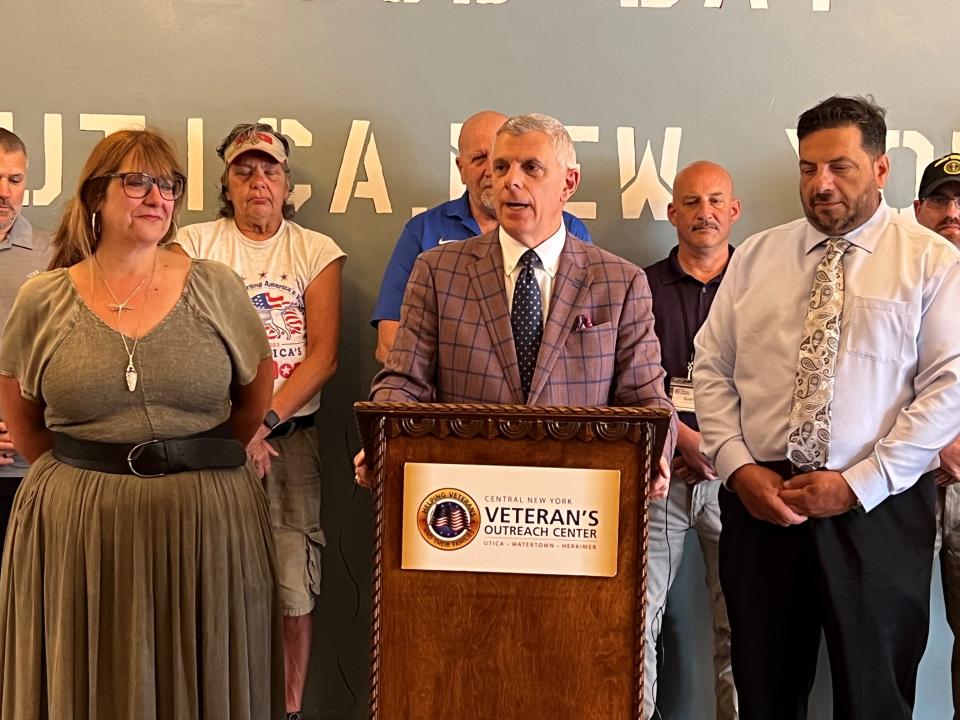 Pictured in front, from left, Sandra Soroka, executive director of the Neighborhood Center; Oneida County Executive Anthony J. Picente Jr. and Vincent Scalise, executive director of Utica Center for Development are flanked by veterans at a press conference at the Utica Center for Development in Utica on June 1, 2023 to launch the county’s Staff Sergeant Parker Gordon Fox Suicide Prevention Grant Program.