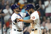Houston Astros' Abraham Toro (13) celebrates with Yuli Gurriel after both scored on Toro's home run against the Chicago White Sox during the seventh inning of a baseball game Thursday, June 17, 2021, in Houston. (AP Photo/David J. Phillip)