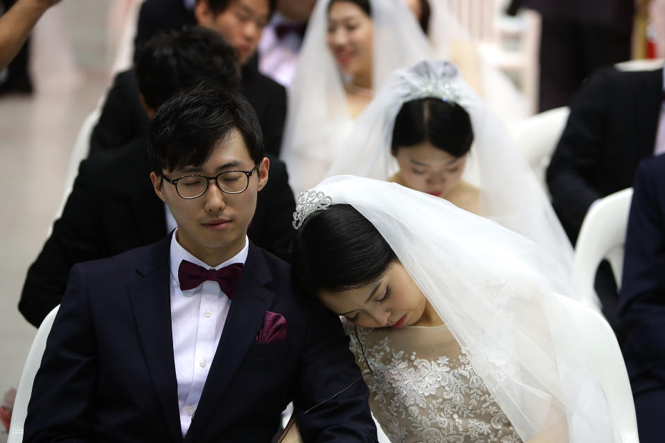 GAPYEONG-GUN, SOUTH KOREA - SEPTEMBER 07:  A bride sleep before the wedding ceremony of the Family Federation for World Peace and Unification, commonly known as the Unification Church, at Cheongshim Peace World Center on September 7, 2017 in Gapyeong-gun, South Korea. Some 3,000 'Moonies', believers of Unification Church, which was named after the founder Moon Sun Myung, attend the mass wedding which began in the early 1960s.  (Photo by Chung Sung-Jun/Getty Images)