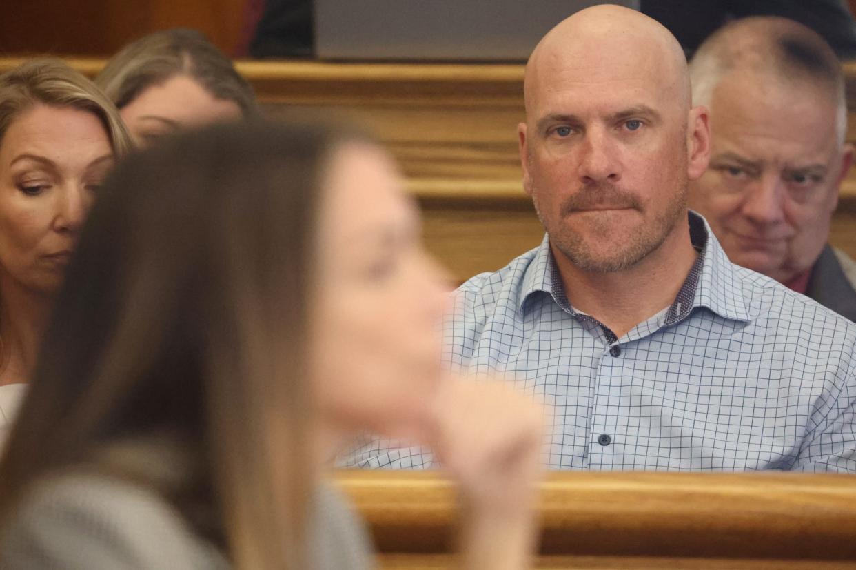 Paul O'Keefe, brother of the John O’Keefe, stares at Karen Read during her trial on murder charges in Dedham Superior Court on Tuesday, May 7, 2024.