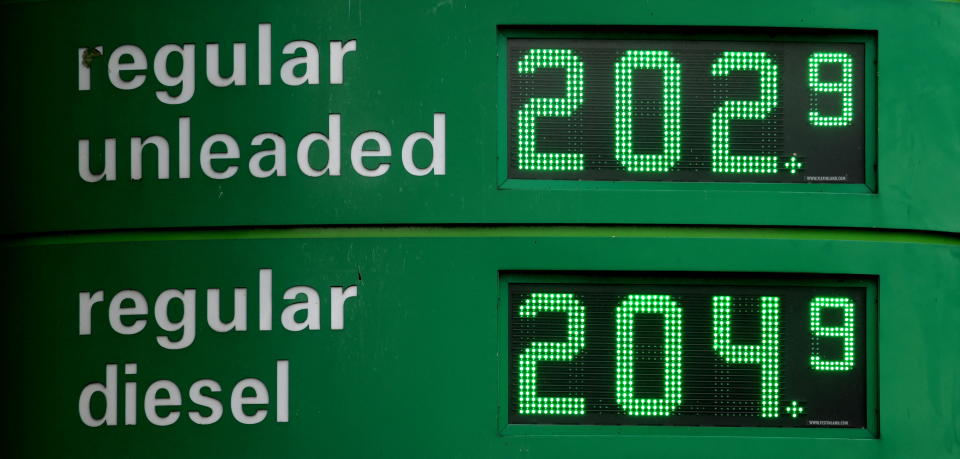 Increased petrol and diesel are seen on a display board at a filling station