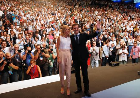 Pablo Casado, and his wife Isabel Torres Orts, reacts after being elected as the new leader of Spain's conservative People's Party in Madrid, Spain, July 21, 2018. REUTERS/Javier Barbancho