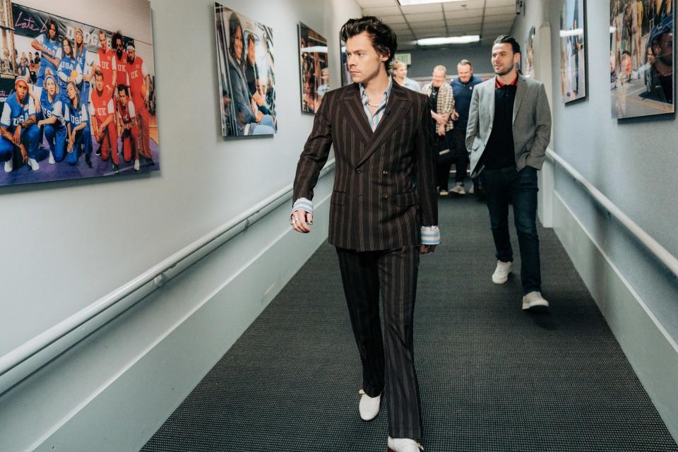 Harry Styles heads down the halls of <i>The Late Late Show with James Corden</i> before taking his post as guest host on Tuesday in L.A.