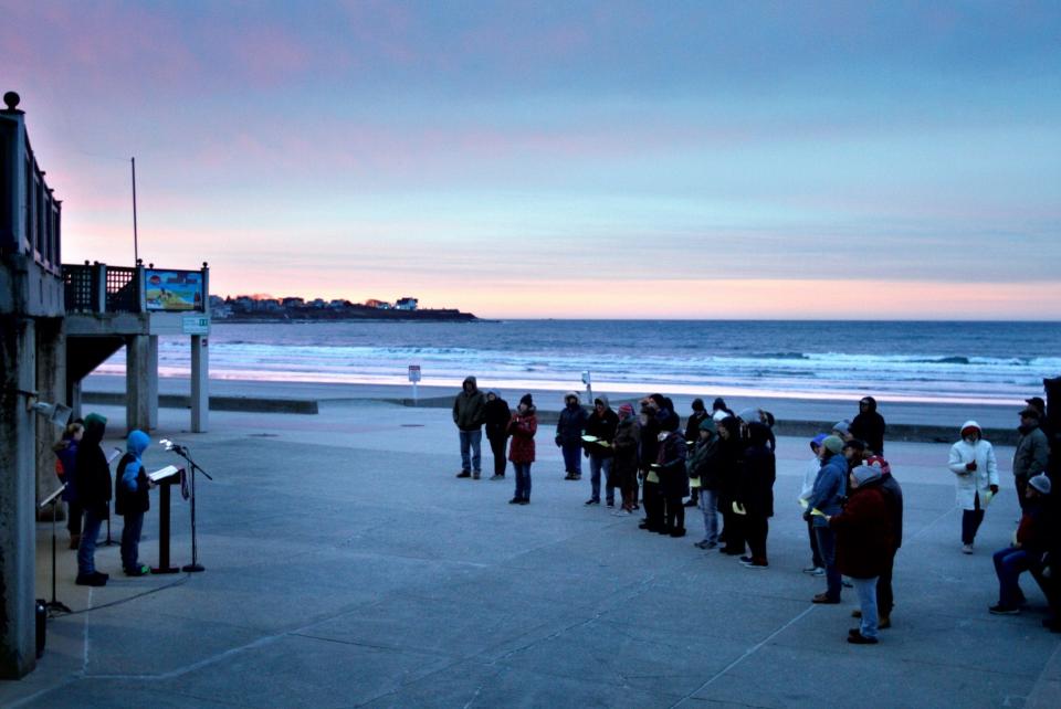 Newport, RI, April 1, 2018 - Worshipers attend an Easter Sunday Sunrise service at the Easton¥s Beach rotunda in Newport presented by members of the Calvary United Methodist Church youth group. The Providence Journal / Kris Craig]