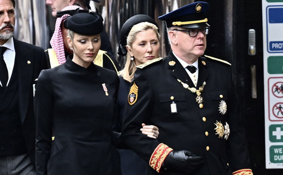 Monaco's Prince Albert II (2ndL) and his wife Charlene