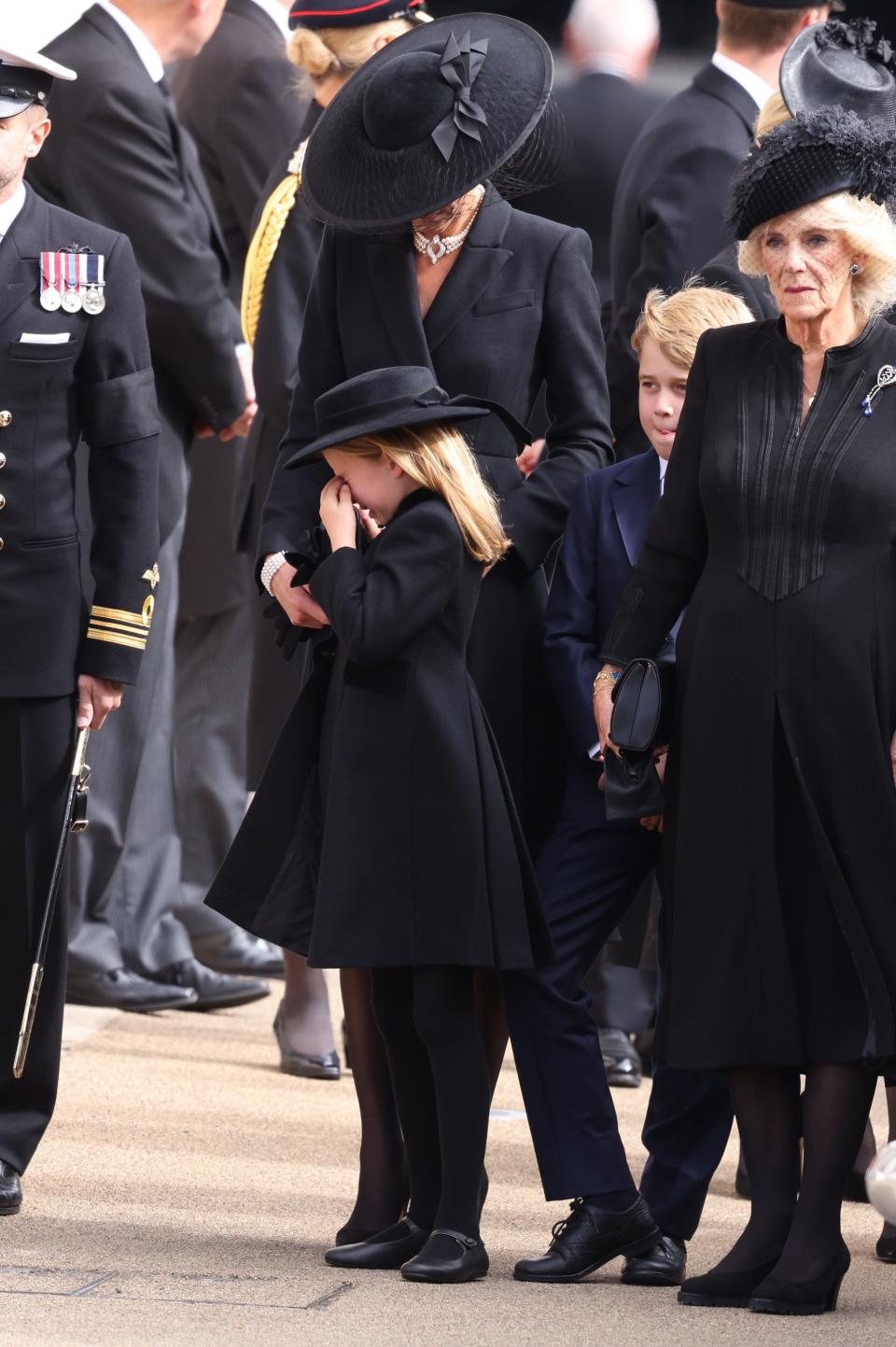Princess Charlotte of Wales cries next to her mother, Princess Kate, brother Prince George and Queen Consort Camilla at Wellington Arch after the State Funeral of Queen Elizabeth II on Sept. 19, 2022.