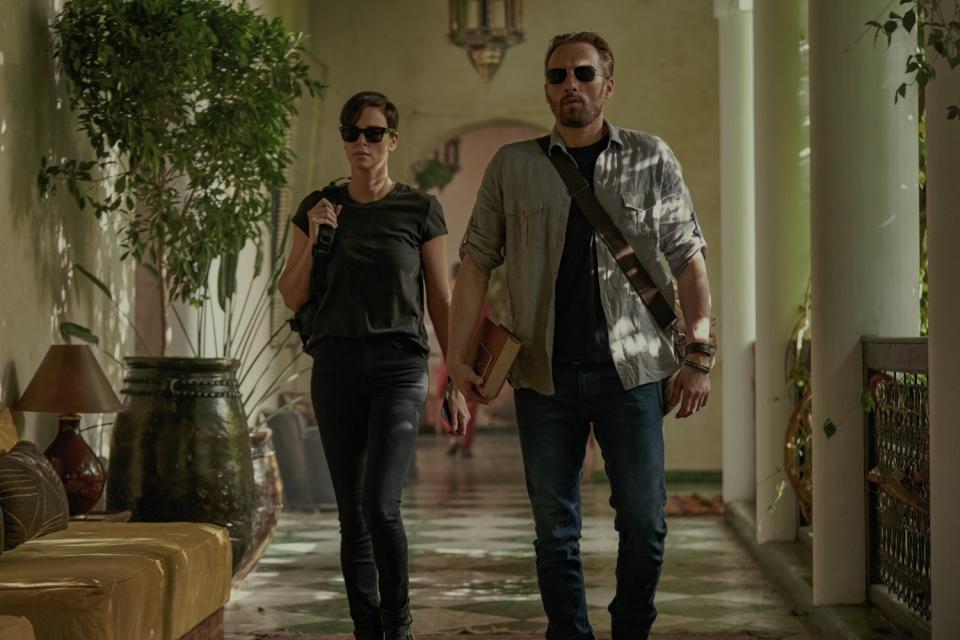 THE OLD GUARD (L to R) CHARLIZE THERON as ANDY and MATTHIAS SCHOENAERTS as BOOKER in "The Old Guard."