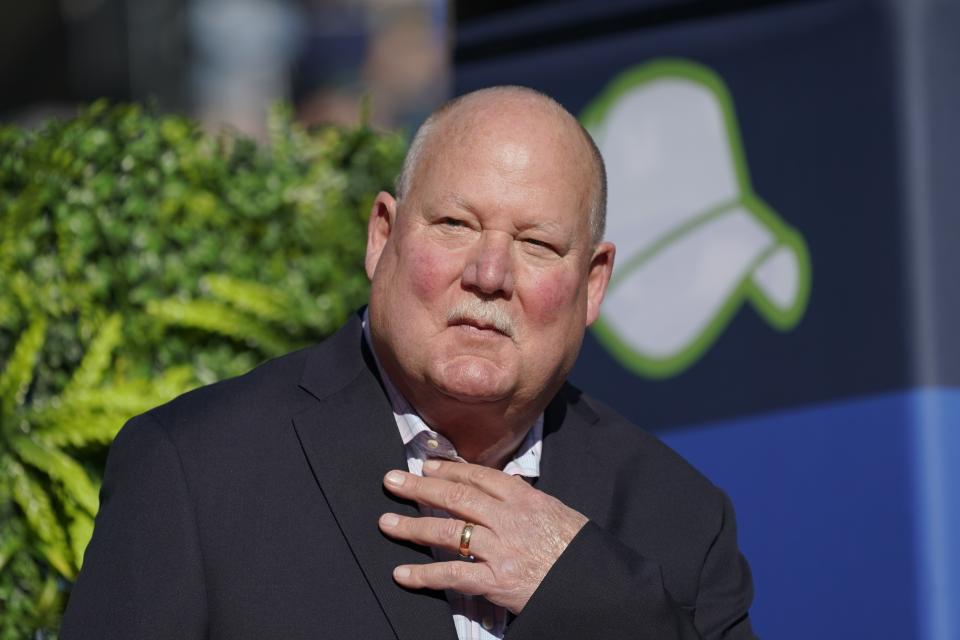 FILE - Former Seattle Seahawks coach Mike Holmgren speaks after being introduced as the newest member of the team's Ring of Honor during halftime in an NFL football game, Sunday, Oct. 31, 2021, in Seattle. Super Bowl-winning coaches Mike Shanahan and Mike Holmgren are among 24 seniors, coaches and contributors selected as finalists for the Pro Football Hall of Fame’s Class of 2023. (AP Photo/Ted S. Warren, File)