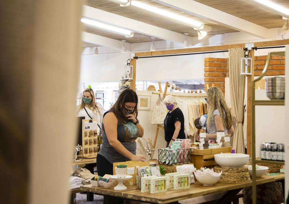 Customers file in and out of the vendors' booths at the Merchantile in Scottsdale on Nov. 21, 2020.