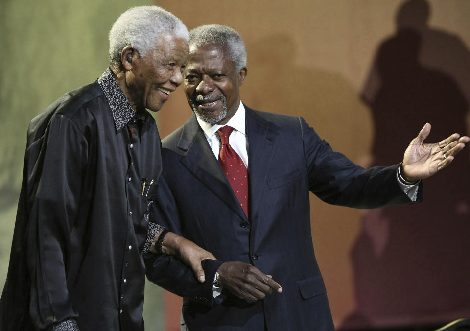 FILE - In this July 22, 2007 file photo, Nelson Mandela and former United Nations Secretary General Kofi Annan arrive together at the 5th annual Nelson Mandela Lecture at the Linder Auditorium in Johannesburg, South Africa. The United Nations is seeking to harness the soaring symbolism of Mandela, whose South African journey from anti-apartheid leader to prisoner to president to global statesman is one of the 20th century's great stories of struggle, sacrifice and reconciliation. The unveiling of a statue of Mandela, born 100 years ago, with arms outstretched at the U.N. building in New York on Monday, Sept. 24, 2018, opens a peace summit at the General Assembly. (AP Photo, File)