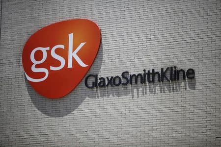 The logo of GlaxoSmithKline (GSK) is seen on its office building in Shanghai July 12, 2013. REUTERS/Aly Song