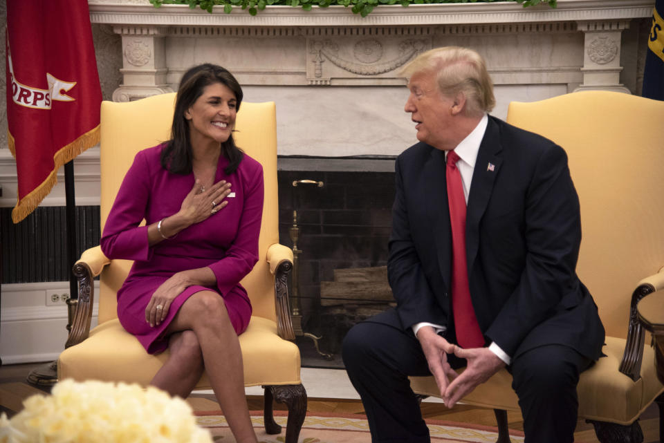 Nikki Haley, U.S. ambassador to the United Nations, smiles as President Trump compliments her after she announced her plan to resign on October 9, 2018. (Photo by Calla Kessler/The Washington Post via Getty Images)