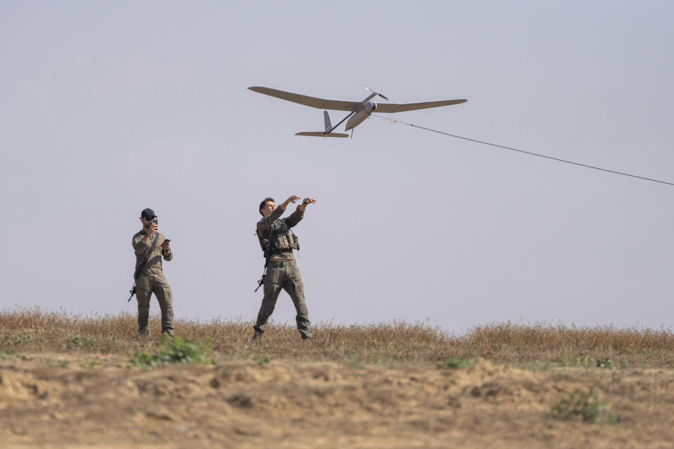 Israeli soldiers launch a drone near the Israeli-Gaza border, southern Israel, Monday, April 15, 2024. (AP Photo/Ohad Zwigenberg