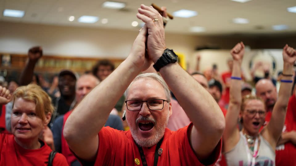 People react as the result of a vote comes in favour of the hourly factory workers at Volkswagen's assembly plant to join the United Auto Workers (UAW) union, at a watch party in Chattanooga, Tennessee, US, April 19, 2024. - Seth Herald/Reuters