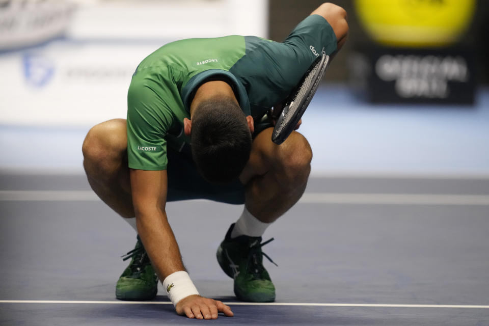 Serbia's Novak Djokovic celebrates after winning the singles tennis match against Denmark's Holger Rune, of the ATP World Tour Finals at the Pala Alpitour, in Turin, Italy, Monday, Nov. 13, 2023. (AP Photo/Antonio Calanni)