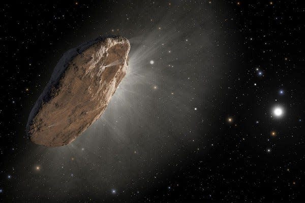 An artist's depiction of the interstellar comet 'Oumuamua as it warmed up on its approach to the sun and outgassed hydrogen slightly altered its orbit. The comet, which is most likely pancake-shaped, is the first known object other than dust grains to visit our solar system from another star.