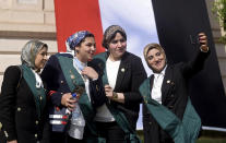New judges take a photo after a swearing-in ceremony before Egypt’s State Council, in Cairo, Egypt, Tuesday, Oct. 19, 2021. Ninety eight women have become the first female judges to join the council, one of the country’s main judicial bodies. The swearing-in came months after President Abdel Fattah el-Sissi asked for women to join the State Council and the Public Prosecution, the two judicial bodies that until recently were exclusively male. (AP Photo/Tarek Wajeh)