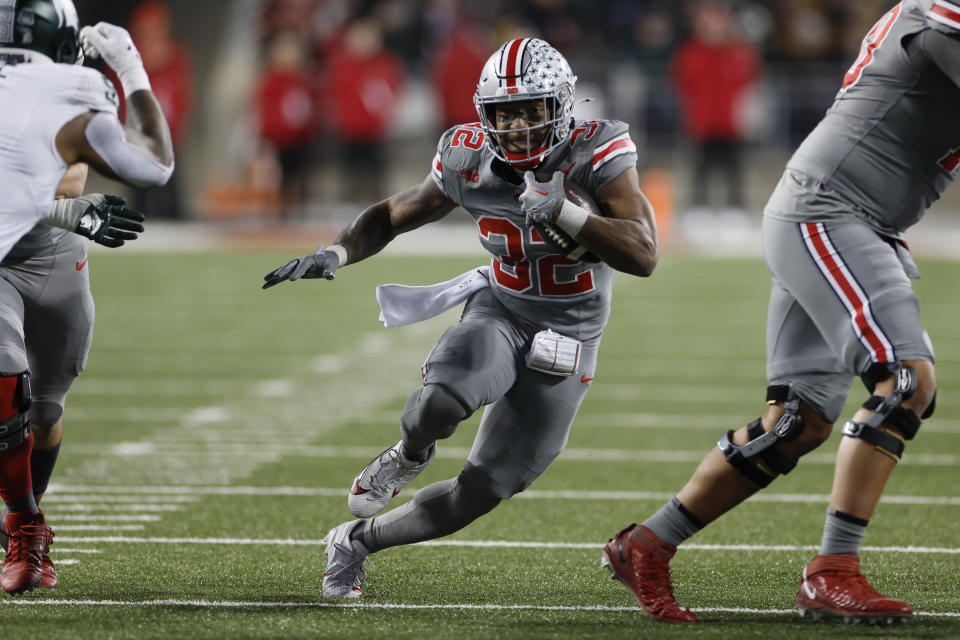 FILE - Ohio State running back TreVeyon Henderson plays against Michigan State during an NCAA college football game Saturday, Nov. 11, 2023, in Columbus, Ohio. TreVeyon Henderson said Wednesday, Dec. 27, 2023 that he would play when Buckeyes (11-1) play Missouri (10-2) in the Cotton Bowl.(AP Photo/Jay LaPrete, File)