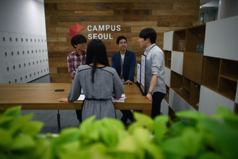 Google has previously opened campuses in Seoul, pictured, providing a South Korean hub for a new generation of tech entrepreneurs Google campus members stand around a table during a media tour, in the Gangnam district of Seoul on May 8, 2015. Google formally opened its first Asian start-up "campus" in Seoul on -- a marquee-name nod to South Korea's aspirations as a regional hub for a new generation of tech entrepreneurs. As well as providing a space for people to work and network, it offers mentoring and training by Google teams and experienced entrepreneurs, as well as access to other start-up communities in Asia and beyond. AFP PHOTO / Ed Jones