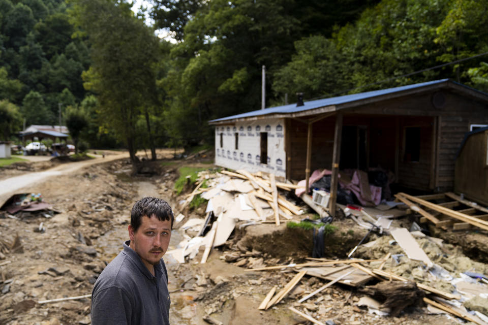 Image: Burley White in front of his flooded house at the River Caney community of Lost Creek on Aug. 18, 2022. (Michael Swensen for NBC News)