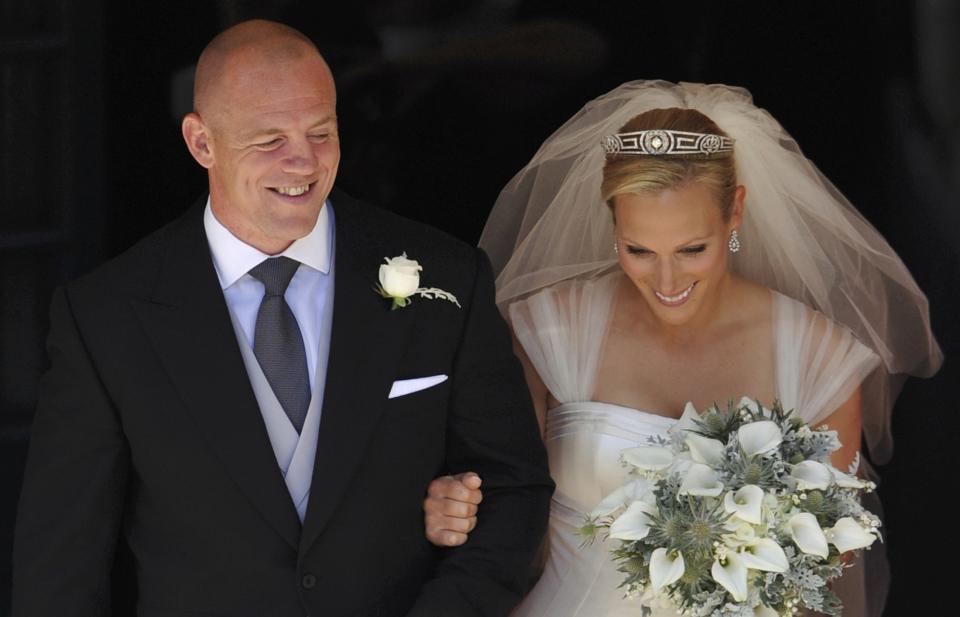 Britain's Zara Phillips, granddaughter of Britain's Queen Elizabeth, and her husband, England rugby star Mike Tindall, leave after their marriage at Canongate Kirk in Edinburgh, Scotland July 30, 2011. (AP Photo/Dylan Martinez, pool)