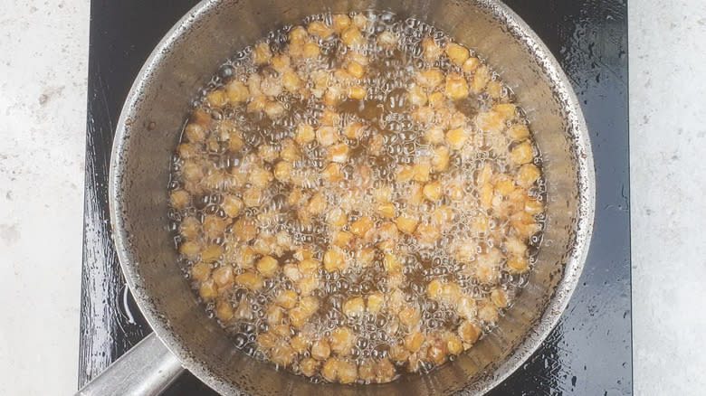 Corn frying in oil