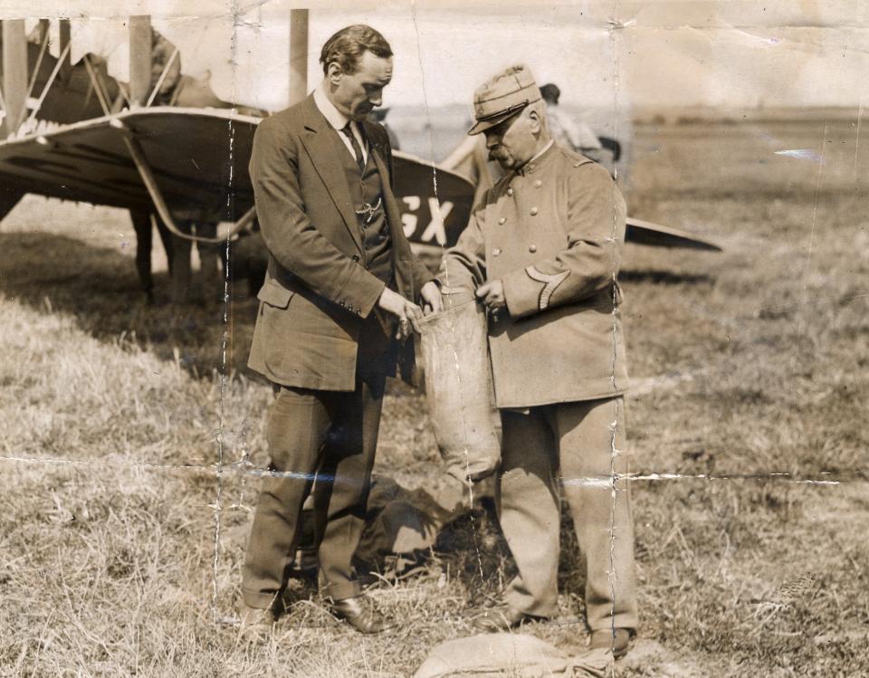 E.H.Lawford with a French customs officer after landing in France after the first flight. (Group Published Images)