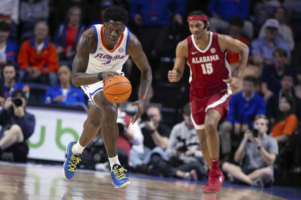 Florida forward Tyrese Samuel (4) steals the ball from Alabama forward Jarin Stevenson (15) during the first half of an NCAA college basketball game Tuesday, March 5, 2024, in Gainesville, Fla. (AP Photo/Alan Youngblood)