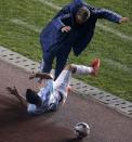 Argentina's Sergio Aguero falls near Argentine coach Gerardo Martino during their Copa America 2015 semi-final soccer match against Paraguay at Estadio Municipal Alcaldesa Ester Roa Rebolledo in Concepcion, Chile, June 30, 2015. REUTERS/Jorge Adorno