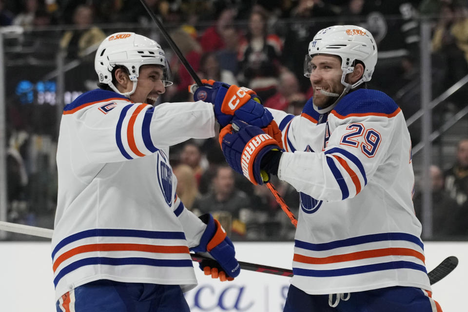 Edmonton Oilers center Leon Draisaitl, right, celebrates after scoring against the Vegas Golden Knights during the first period of an NHL hockey game Saturday, Jan. 14, 2023, in Las Vegas. (AP Photo/John Locher)