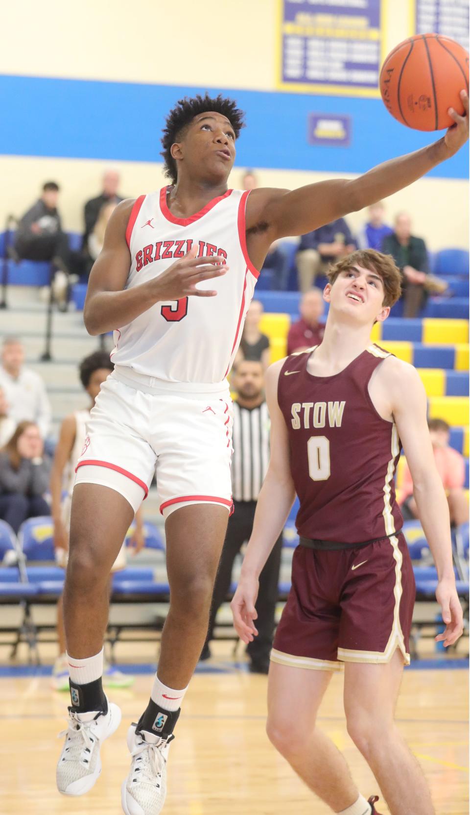 Wadsworth's Solomon Callaghan drives to the basket past Stow's Reece Raymond-Smith in the Greater Akron Basketball Coaches Association Underclassman All-Star game, Tuesday, March 15, 2022 at Coventry High School.
