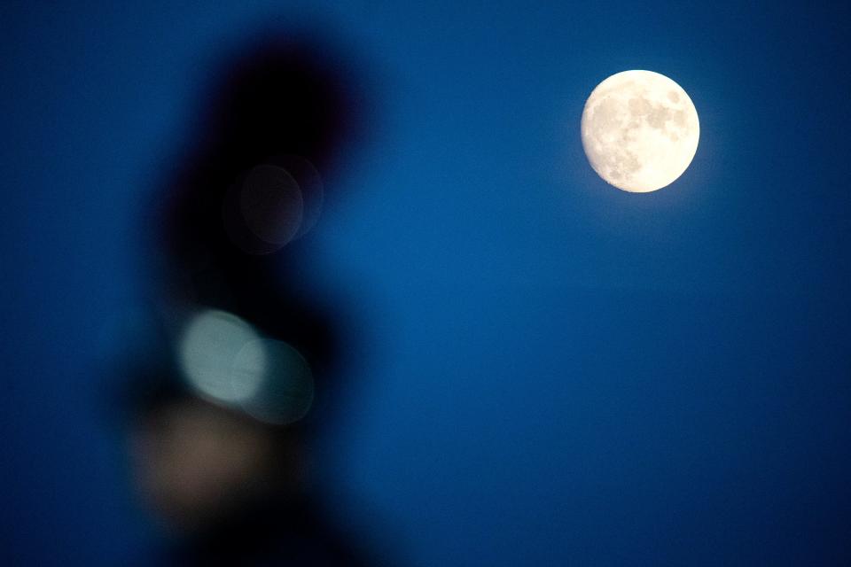 A near full moon lit up the Dover High School Senators football game against the Appoquinimink High School Jaguars at Dover High, Friday, Oct. 7, 2022. Dover won 27-14.