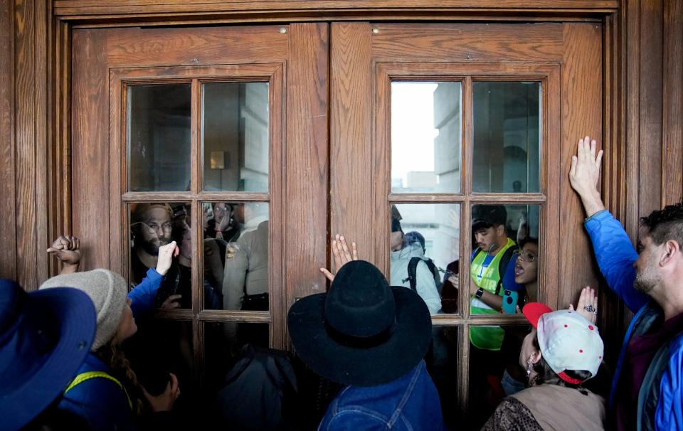 State troopers close the doors to the Tennessee State Capitol in Nashville, Tenn., on Thursday, April 6, 2023, amid protests about the possible expulsion of Democratic representatives Justin Pearson of Memphis, Justin Jones of Nashville and Gloria Johnson of Knoxville.
