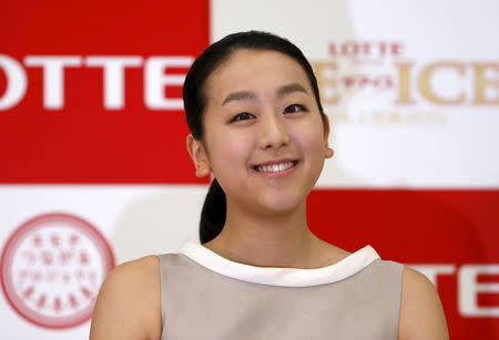 Japanese figure skater Mao Asada smiles during a news conference in Tokyo May 18, 2015. REUTERS/Issei Kato