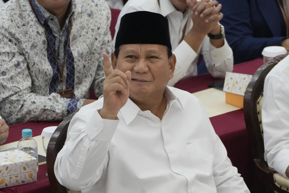 Indonesian Defense Minister and president-elect Prabowo Subianto gestures at the media during his formal declaration as president-elect at the General Election Commission building in Jakarta, Indonesia, Wednesday, April 24, 2024. Indonesia's electoral commission formally Subianto as the elected president in a ceremony on Wednesday after the country's highest court rejected appeals lodged by two losing presidential candidates who are challenging his landslide victory. (AP Photo/Dita Alangkara)