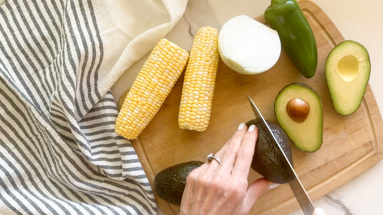 hand cutting avocado