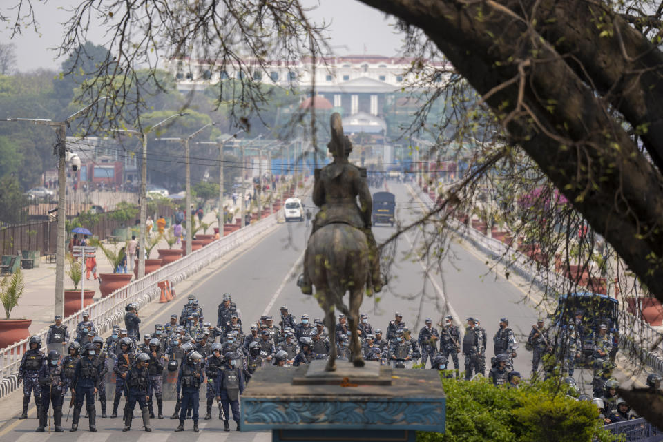 Policemen stand guard at restriction area before supporters of Rastriya Prajatantra Party, or national democratic party starts demonstration demanding a restoration of Nepal's monarchy in Kathmandu, Nepal, Tuesday, April 9, 2024. Riot police used batons and tear gas to halt thousands of supporters of Nepal's former king demanding the restoration of the monarchy and the nation's former status as a Hindu state. Weeks of street protests in 2006 forced then King Gyanendra to abandon his authoritarian rule and introduce democracy. (AP Photo/Niranjan Shrestha)