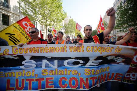 French CGT labour union workers hold a banner during a demonstration against the French government’s reform plans in Marseille as part of a national day of protest, France, April 19, 2018. The slogan reads "The fight goes on". REUTERS/Jean-Paul Pelissier