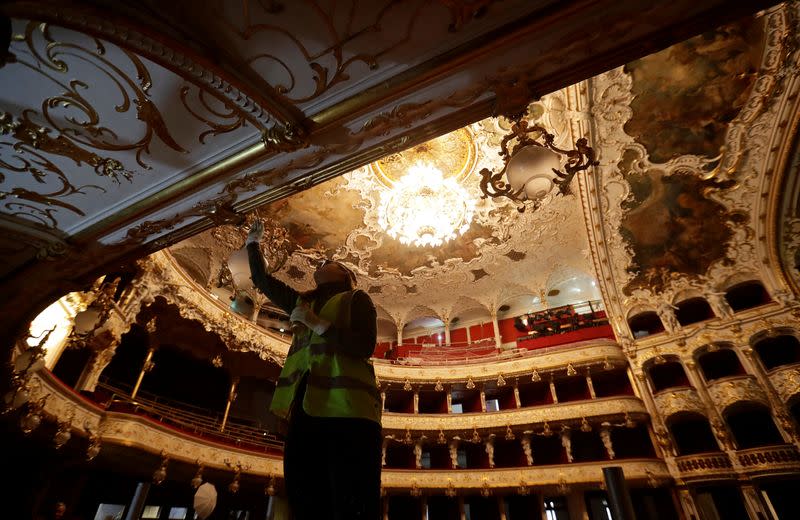 A worker is seen during a general renovation of Prague's State Opera building