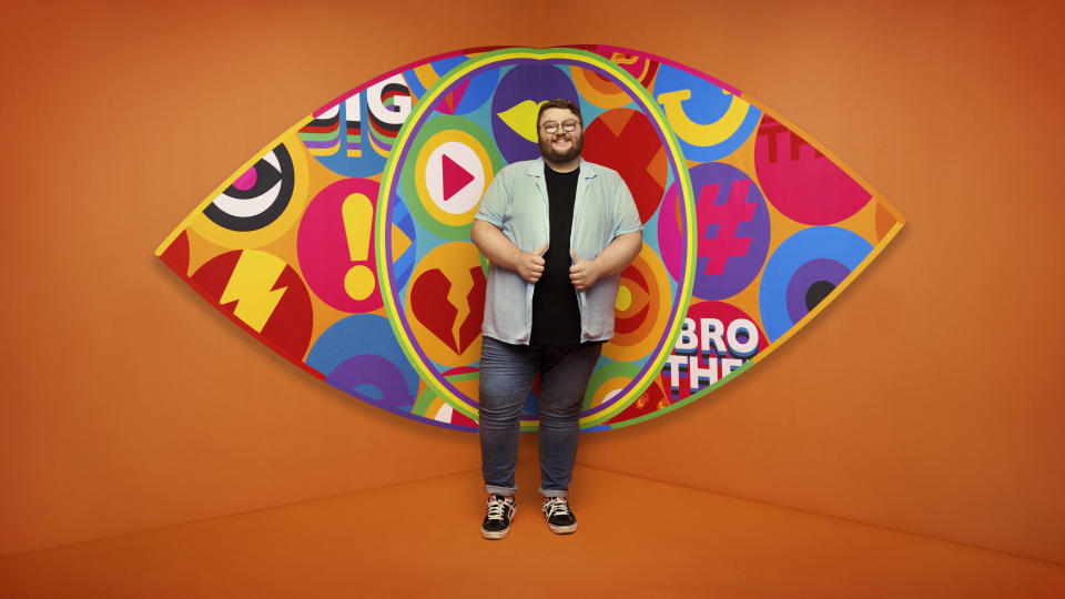 Jenkin pictured in front of the Big Brother logo.