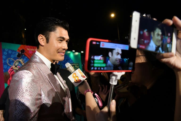 British-Malaysian actor Henry Golding, who stars as Nick Young in Crazy Rich Asians, attends the Singapore premiere of the movie on Wednesday