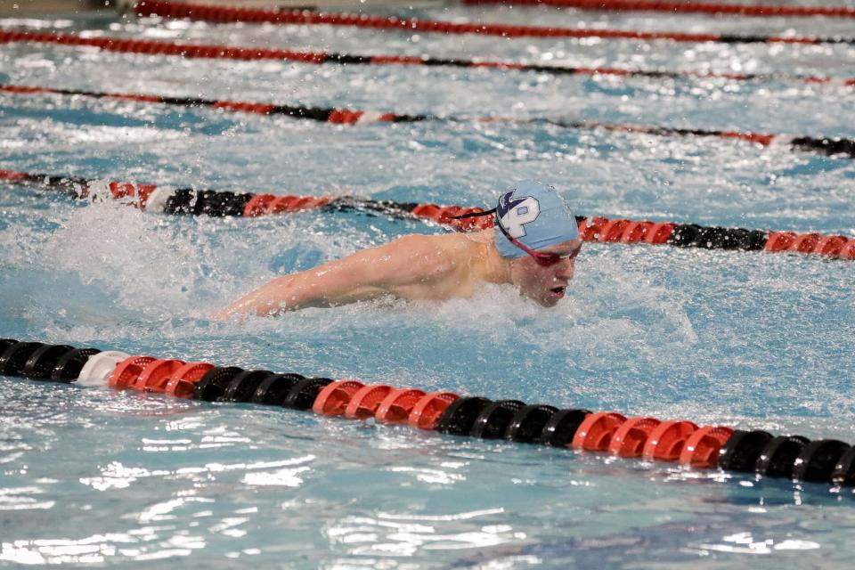 Mason Potts from North Penn pushes through his final lap of the 100 butterfly. Swimmers competed at the 2022 District One swimming meet at York's Graham Aquatic Center on February 26, 2022.