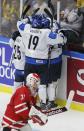 Member's of Finland's team celebrate in front of Canada's goalie Zachary Fucale after a goal by Finland's Joni Nikko during the second period of their IIHF World Junior Championship ice hockey game in Malmo, Sweden, January 4, 2014. REUTERS/Alexander Demianchuk (SWEDEN - Tags: SPORT ICE HOCKEY)