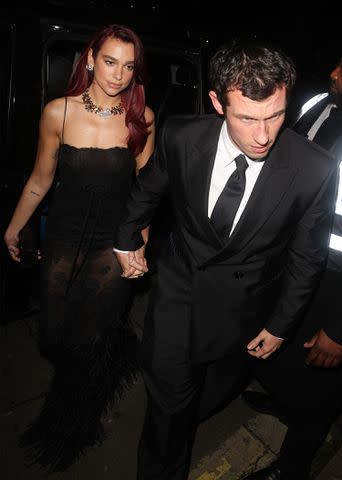 <p>Neil Mockford / Ricky Vigil M/GC Images</p> Dua Lipa and Callum Turner arrived at the bash together