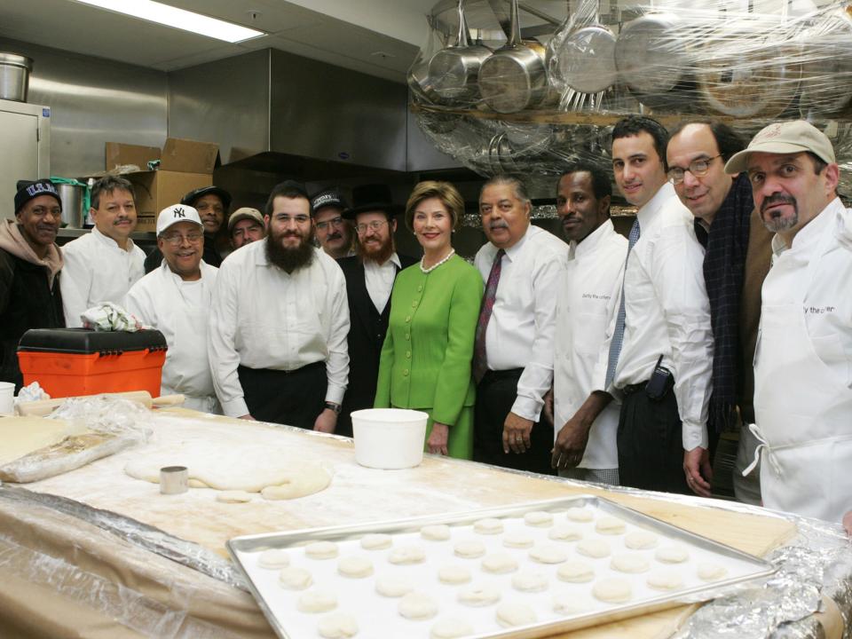 First lady Laura Bush with rabbis and the White House kitchen staff as they make the White House kitchen kosher in 2005.